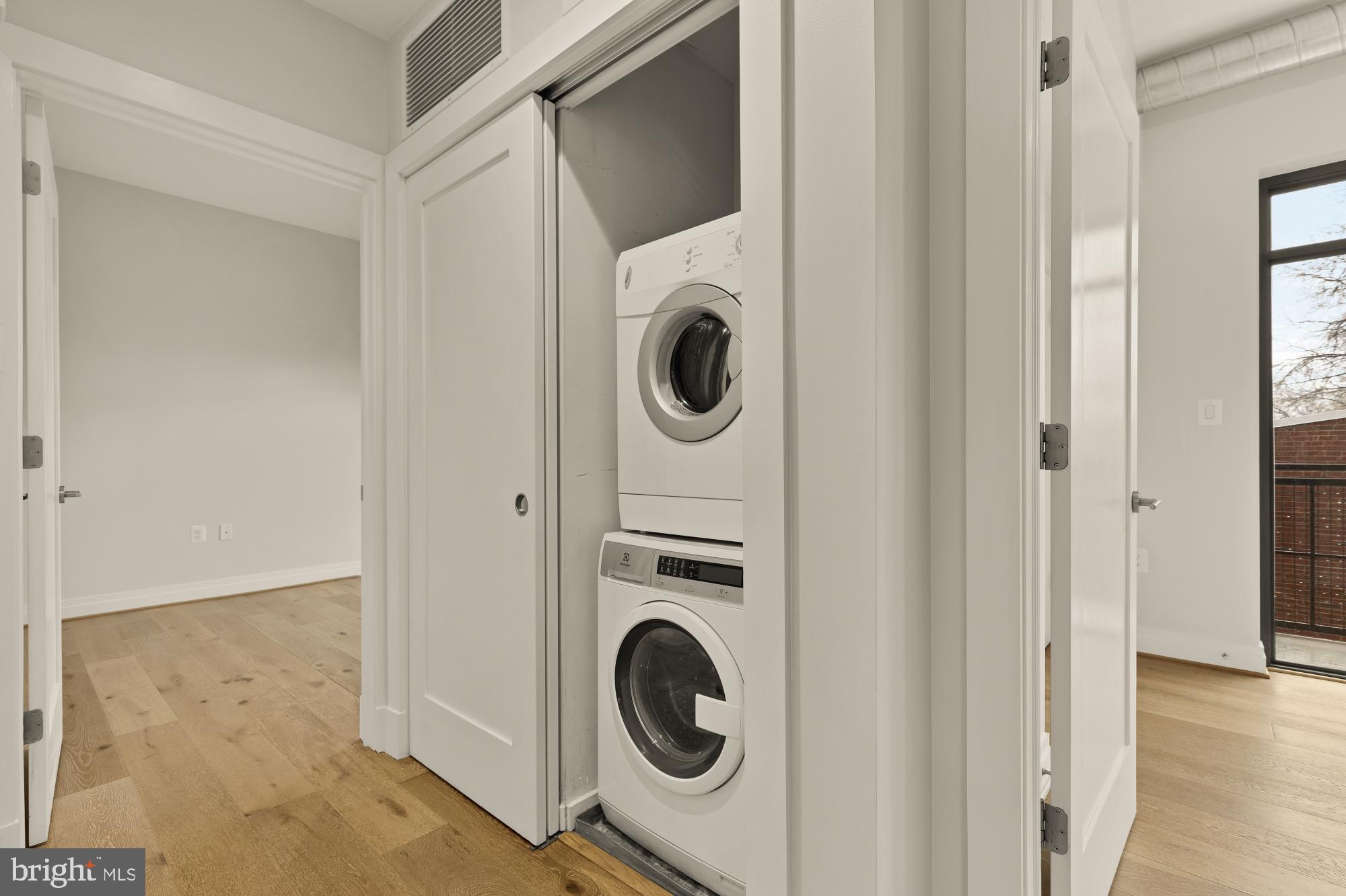 301 H Street Northeast, Unit 305 Washington, DC 20002 - Photo 13 of 25 a utility room with dryer and washer