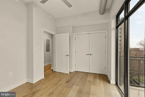 a view of hallway with wooden floor