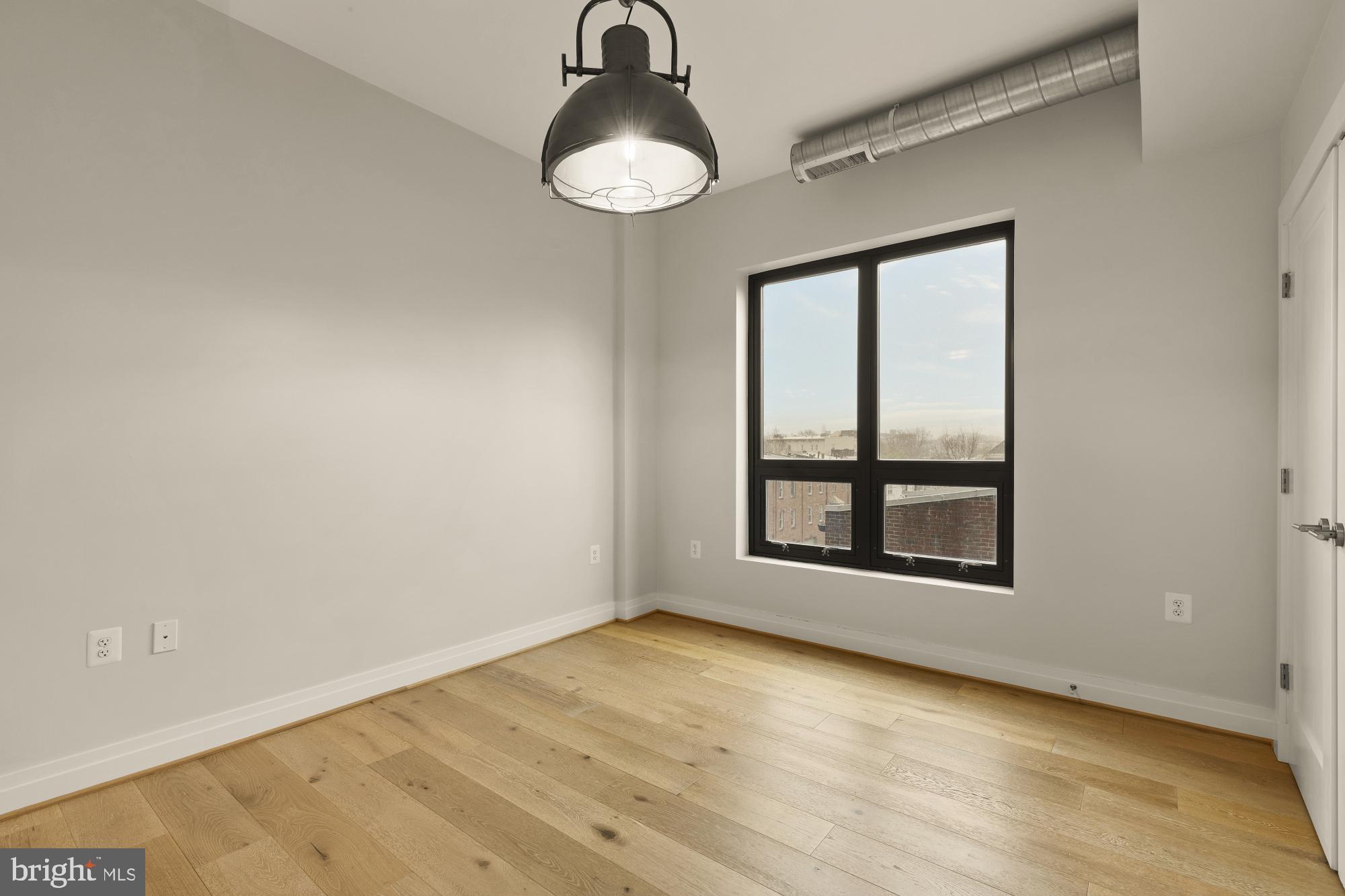 301 H Street Northeast, Unit 305 Washington, DC 20002 - Photo 18 of 25 an empty room with a window