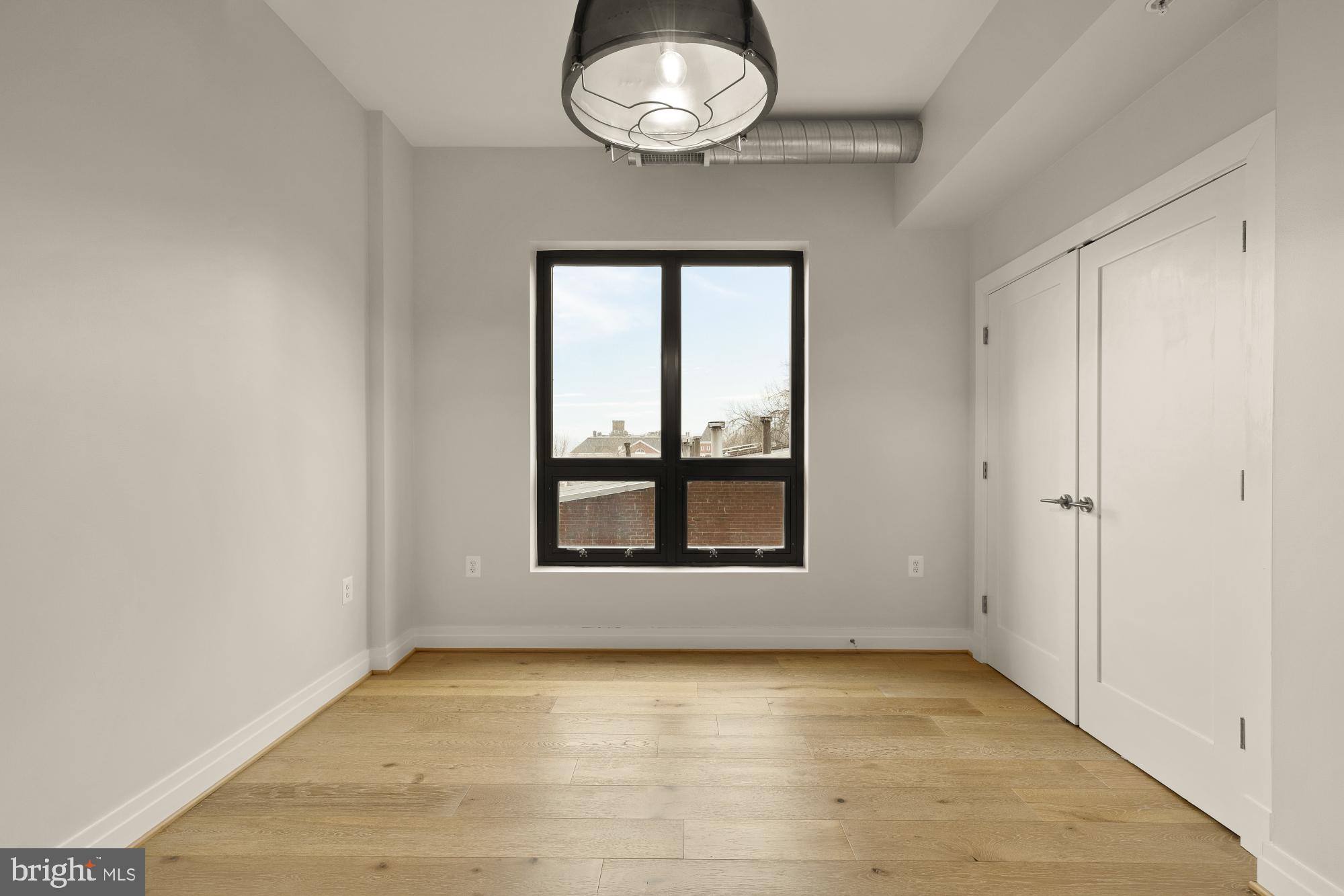 301 H Street Northeast, Unit 305 Washington, DC 20002 - Photo 19 of 25 an empty room with a window