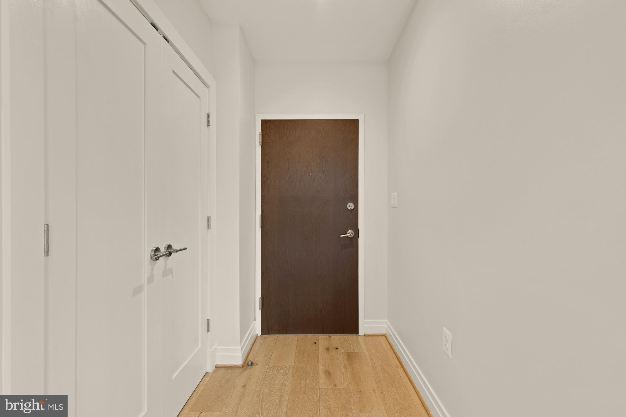 301 H Street Northeast, Unit 305 Washington, DC 20002 - Photo 3 of 25 a view of a hallway with wooden floor