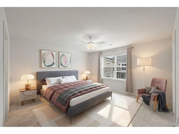 a bedroom with a bed a table and chair