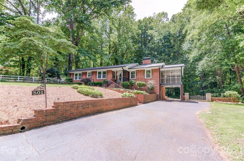 501 Dunham Road Gastonia, NC 28054 - Photo 3 of 38 a view of a house with backyard and sitting area