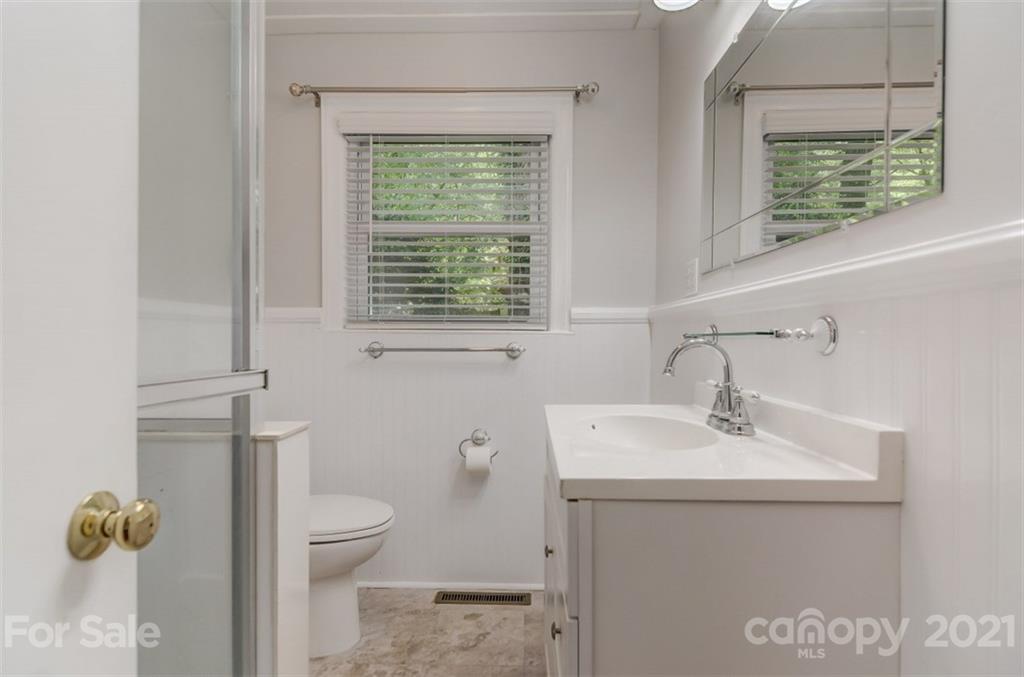 501 Dunham Road Gastonia, NC 28054 - Photo 22 of 38 a bathroom with a sink a toilet and a window