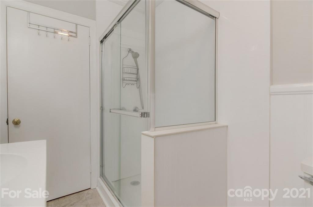 501 Dunham Road Gastonia, NC 28054 - Photo 23 of 38 a bathroom with a glass shower door