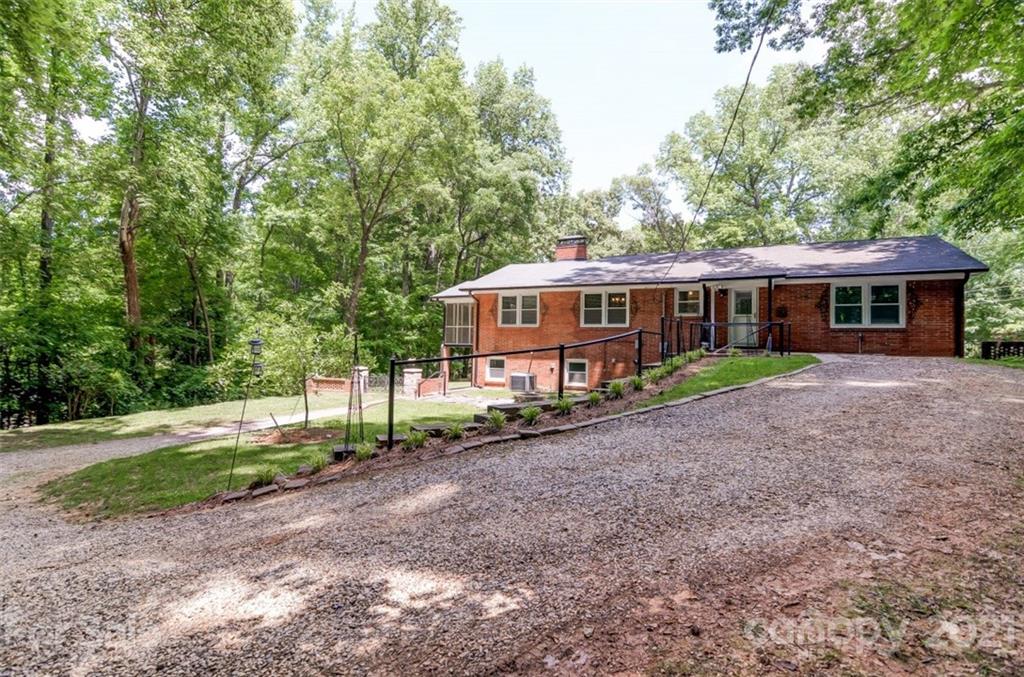 501 Dunham Road Gastonia, NC 28054 - Photo 32 of 38 a view of a house with a yard and sitting area