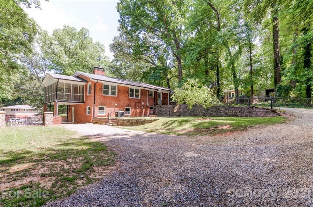 501 Dunham Road Gastonia, NC 28054 - Photo 37 of 38 a view of a house with backyard and sitting area