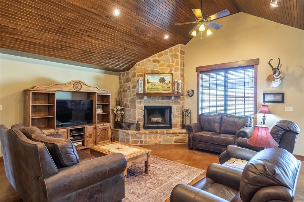 14600 Interstate 20 Roscoe, TX 79545 - Photo 10 of 40 View from Foyer to Living Room Featuring Stone Wood Burning Fireplace