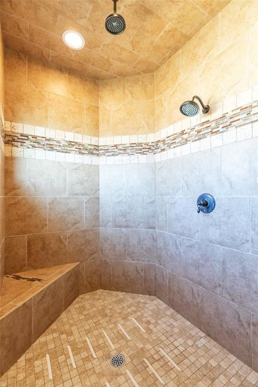14600 Interstate 20 Roscoe, TX 79545 - Photo 23 of 40 Primary Shower With Built In Seat, Niches & Dual Shower Heads