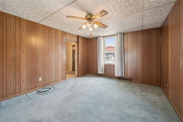 a view of a room with a wooden walls