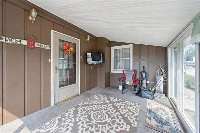 a view of a house with a yard and sitting area