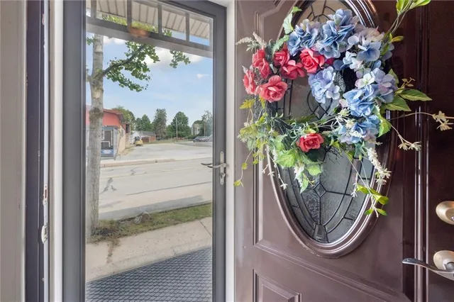 a view of a room with wooden floor and cabinets