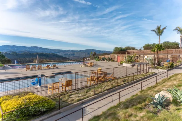 a view of a swimming pool with a terrace