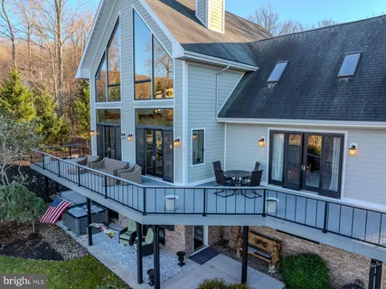 a view of an entryway with wooden floor and windows