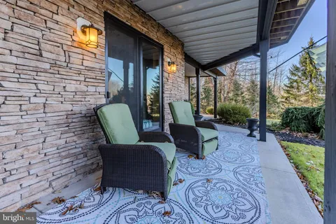 a view of balcony with wooden floor and fence