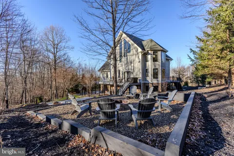 a outdoor living space with furniture and umbrella