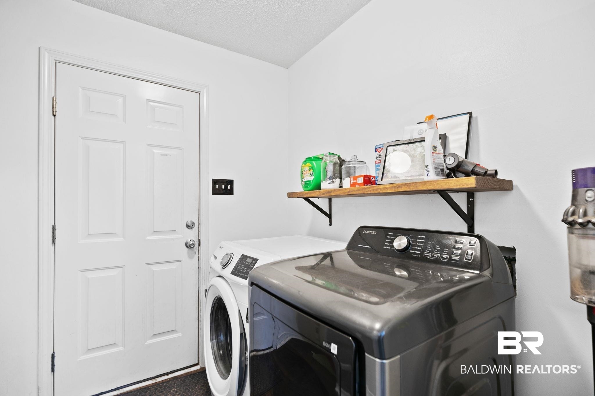 10550 Patrick Avenue Grand Bay, AL 36541 - Photo 29 of 43 Laundry area featuring independent washer and dryer and a textured ceiling