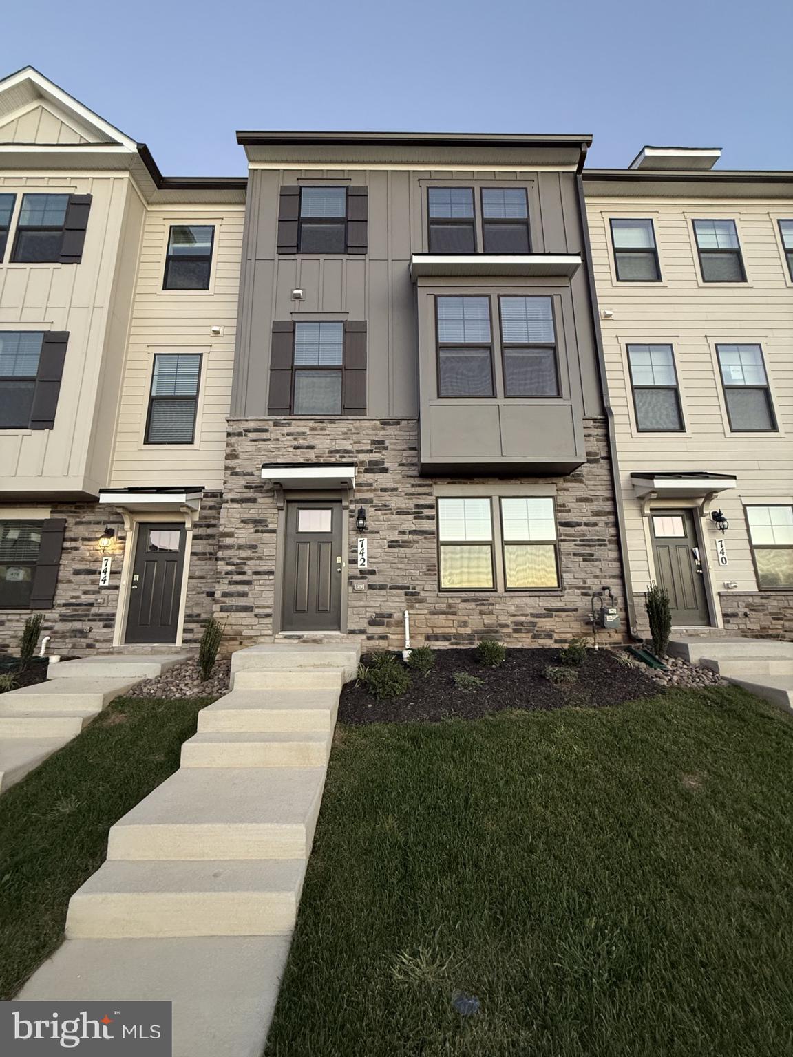 742 Compass Way Frederick, MD 21701 - Photo 1 of 30 a front view of a house with a yard