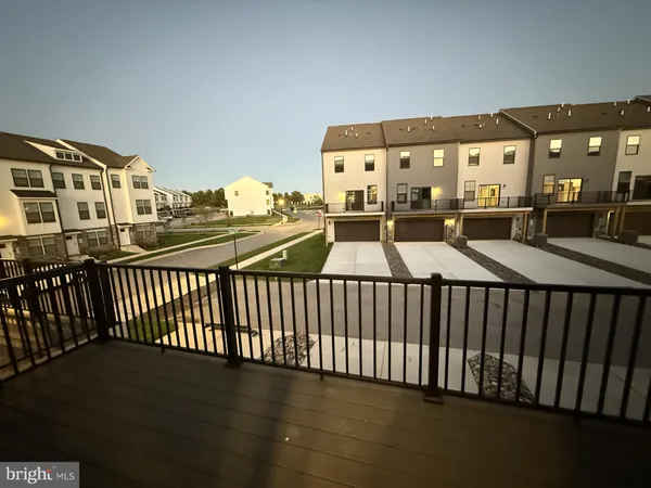 a view of a balcony and car parked