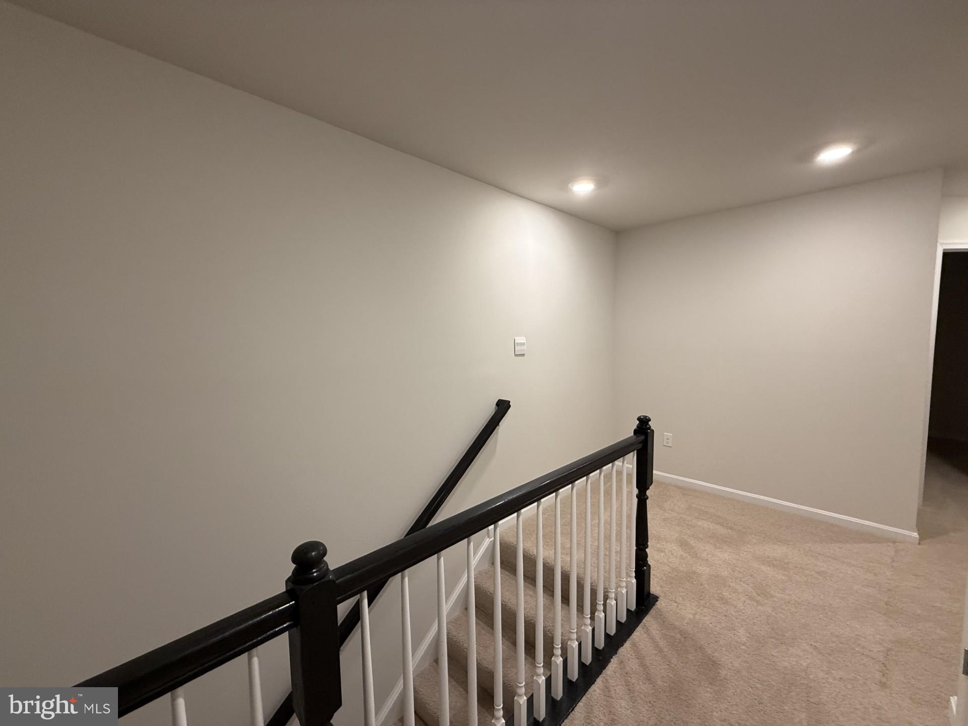 742 Compass Way Frederick, MD 21701 - Photo 21 of 30 a view of staircase with railing and white walls