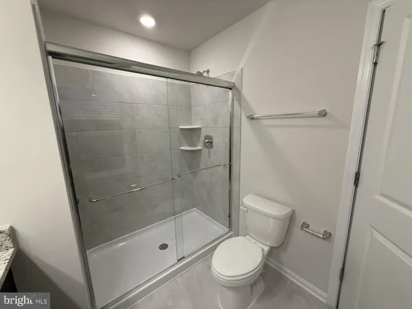 a kitchen with a sink and a mirror