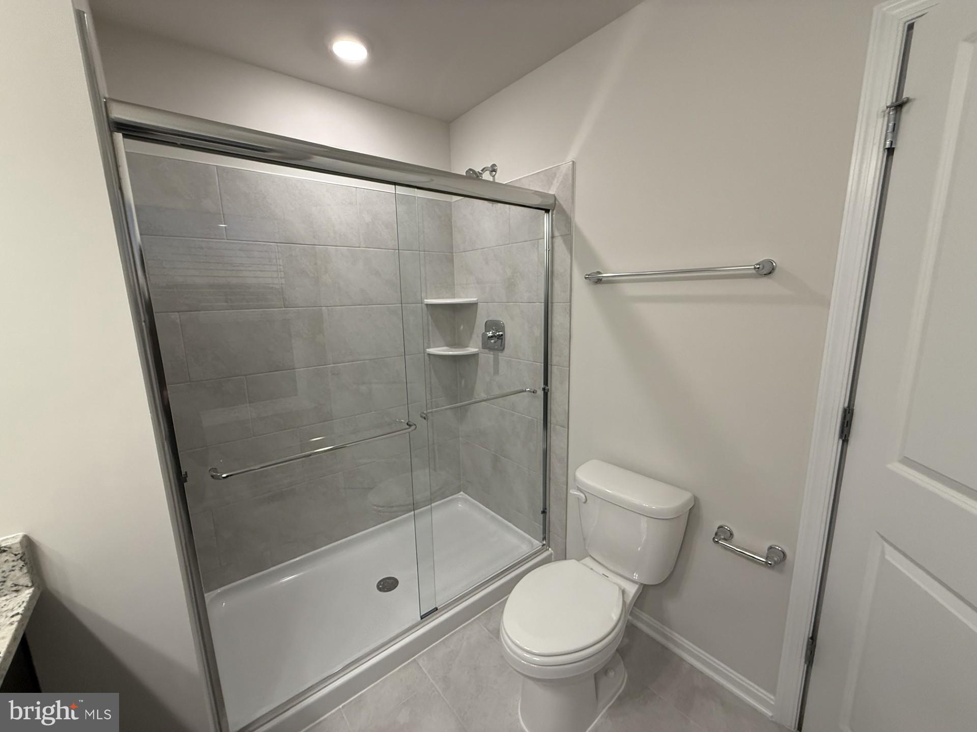 742 Compass Way Frederick, MD 21701 - Photo 23 of 30 a bathroom with a shower and a toilet