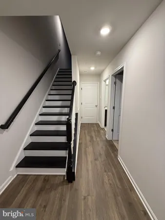 a view of entryway with wooden floor