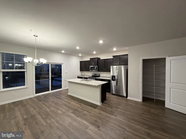a view of a kitchen from the hallway