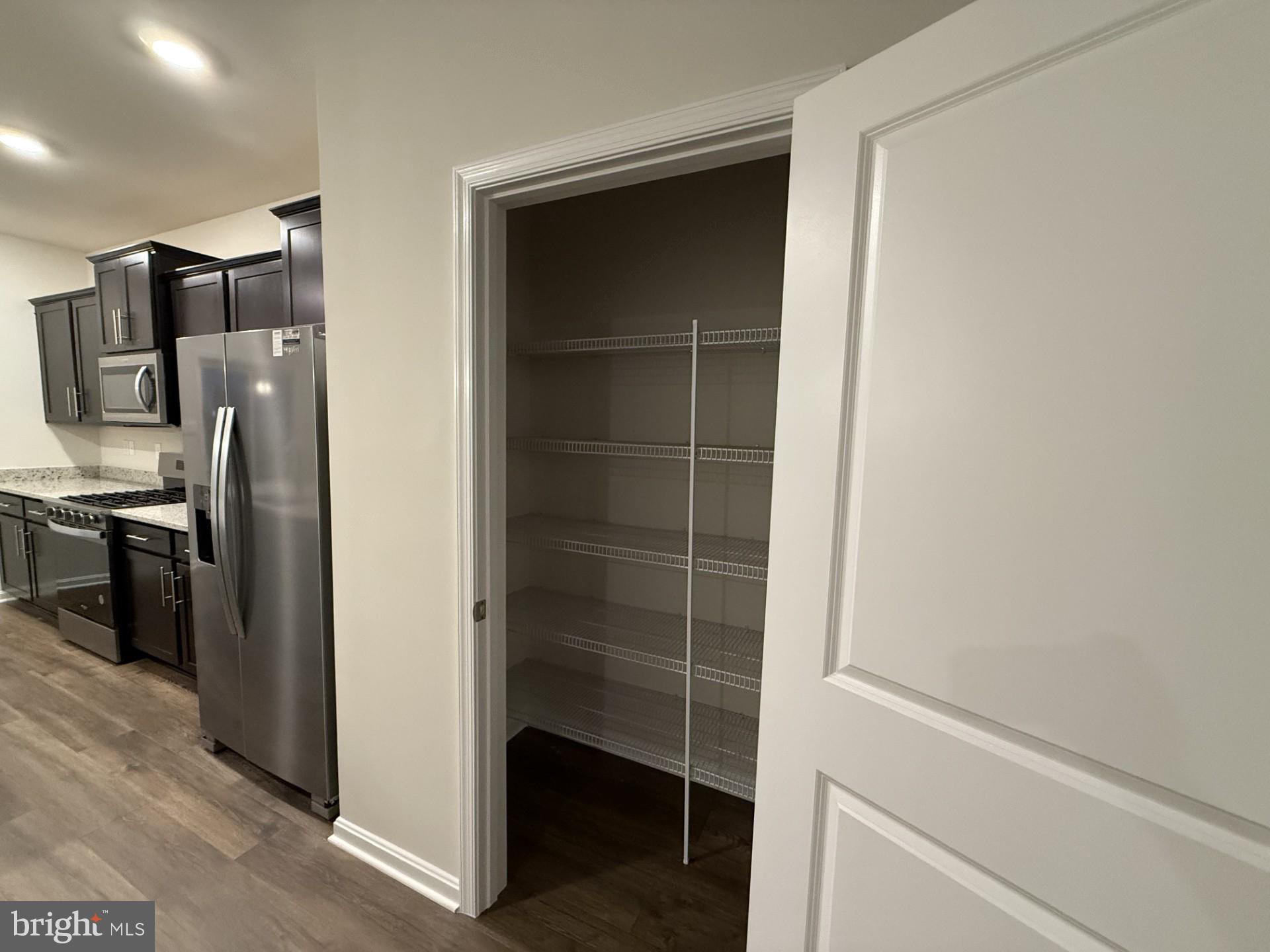 742 Compass Way Frederick, MD 21701 - Photo 9 of 30 a view of a kitchen from the hallway