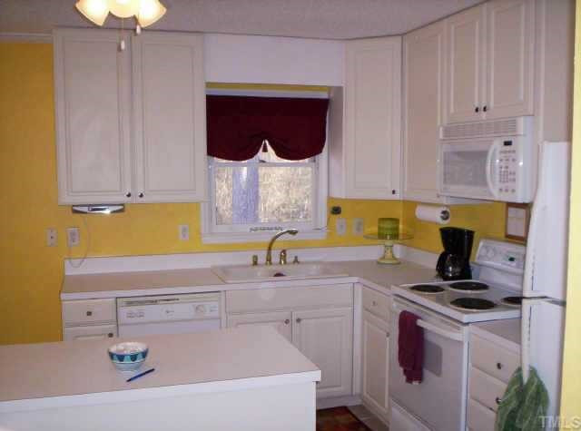 620 Canady Court Willow Spring, NC 27592 - Photo 2 of 10 Kitchen with center island & tile floor Other
