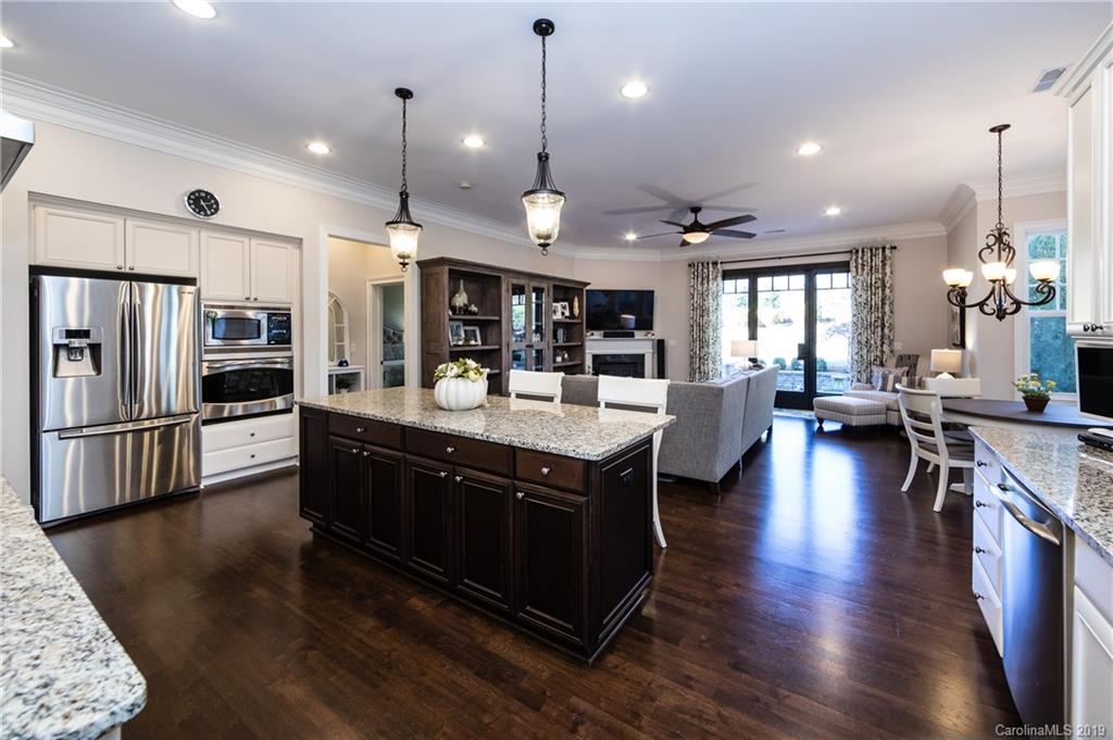 16905 Red Cow Road Charlotte, NC 28277 - Photo 13 of 47 a large kitchen with lots of counter space a sink appliances and living room view