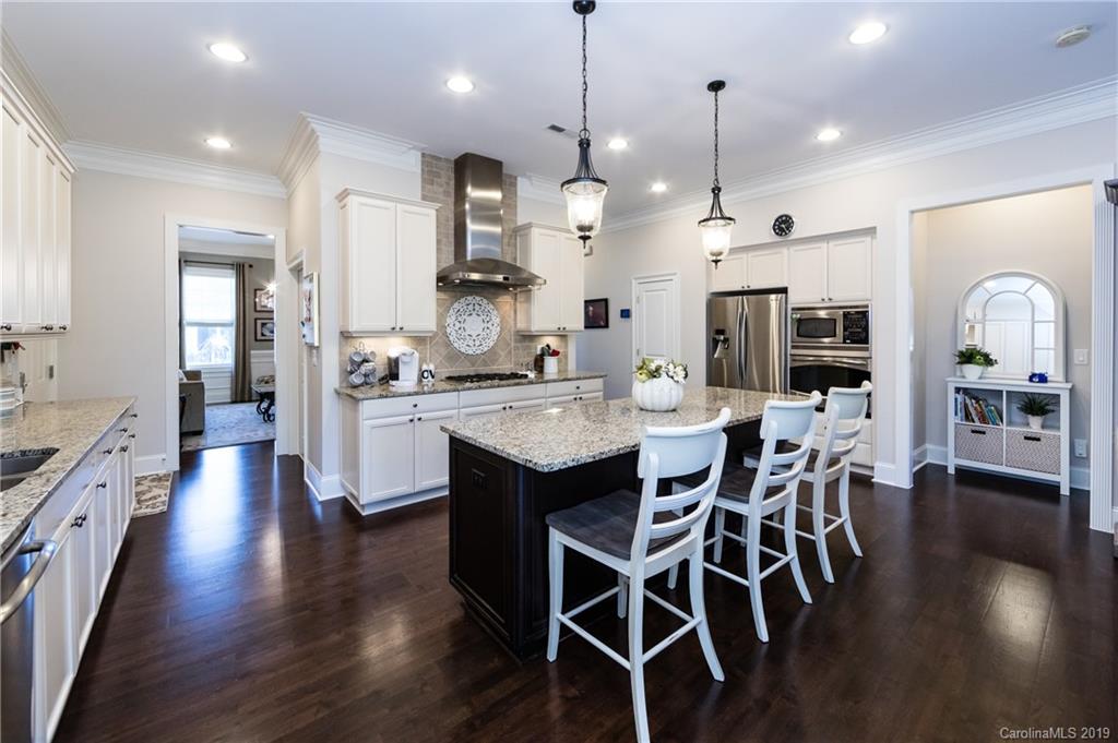 16905 Red Cow Road Charlotte, NC 28277 - Photo 14 of 47 a large kitchen with cabinets a sink a counter space and stainless steel appliances