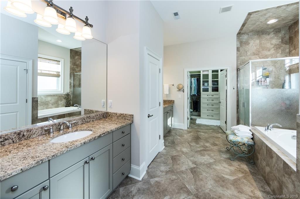 16905 Red Cow Road Charlotte, NC 28277 - Photo 23 of 47 a spacious bathroom with a granite countertop sink mirror and a