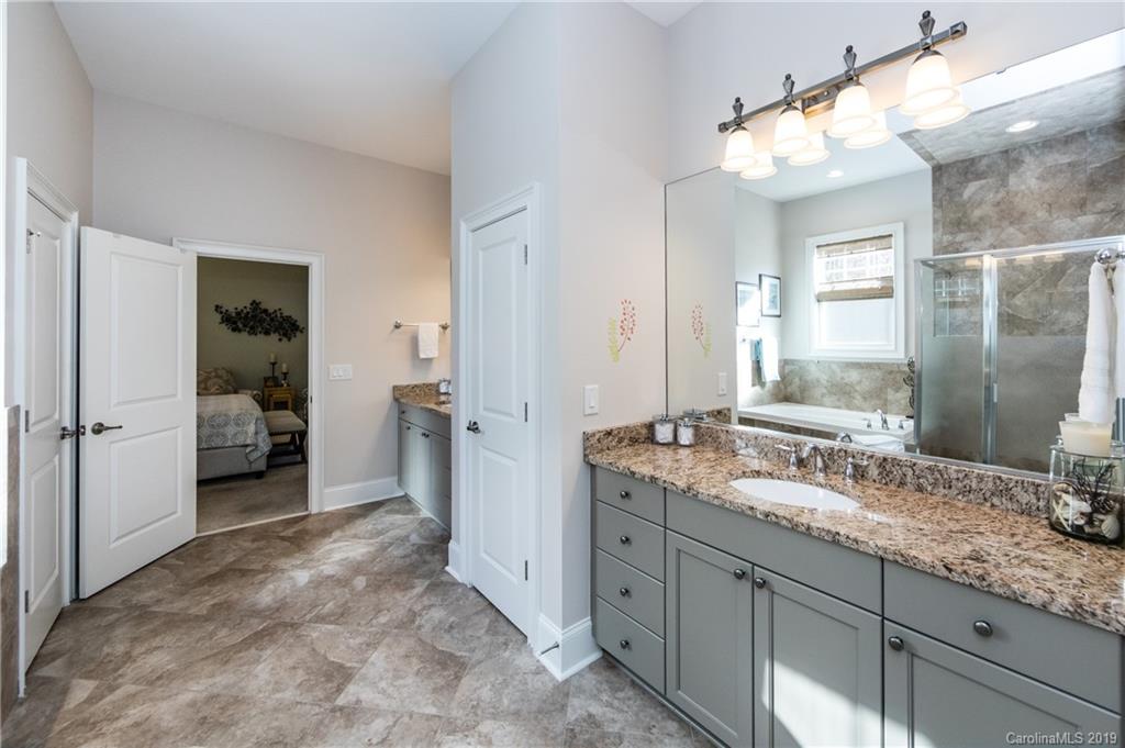 16905 Red Cow Road Charlotte, NC 28277 - Photo 26 of 47 a spacious bathroom with a double vanity sink mirror and shower