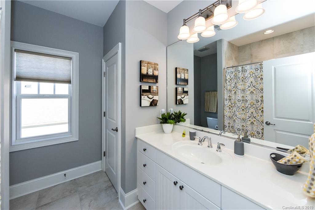 16905 Red Cow Road Charlotte, NC 28277 - Photo 31 of 47 a bathroom with a sink vanity and a mirror