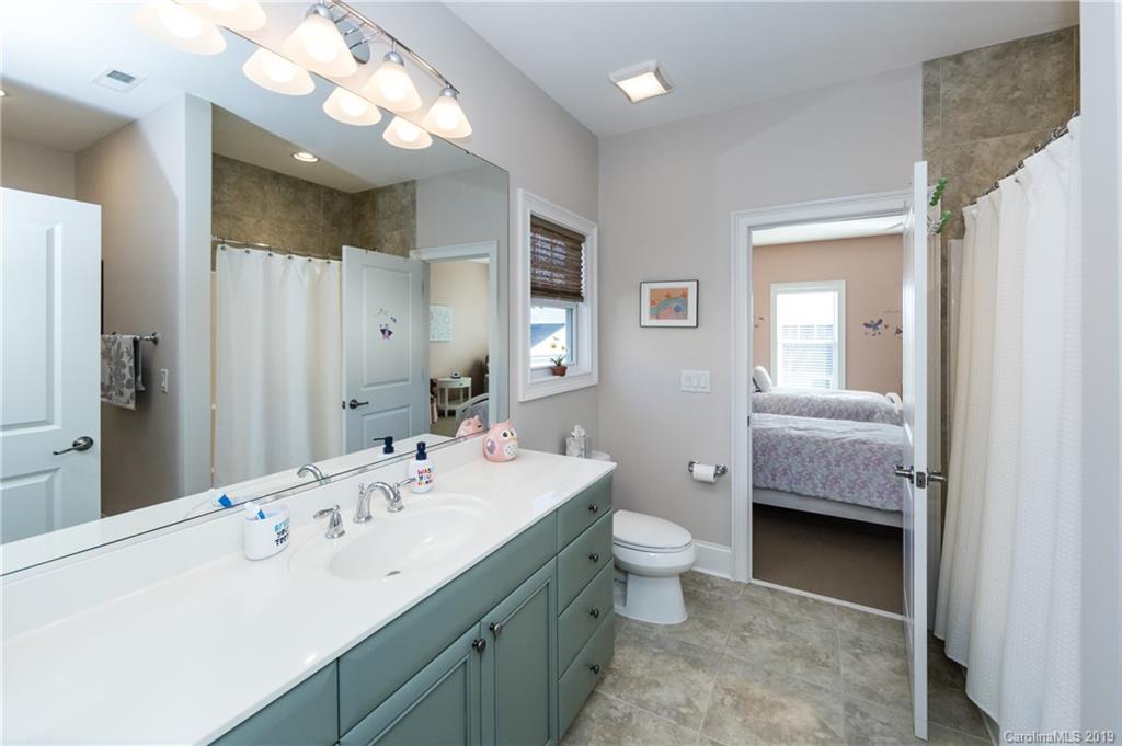 16905 Red Cow Road Charlotte, NC 28277 - Photo 35 of 47 a en suite bathroom with a double vanity sink toilet and a mirror