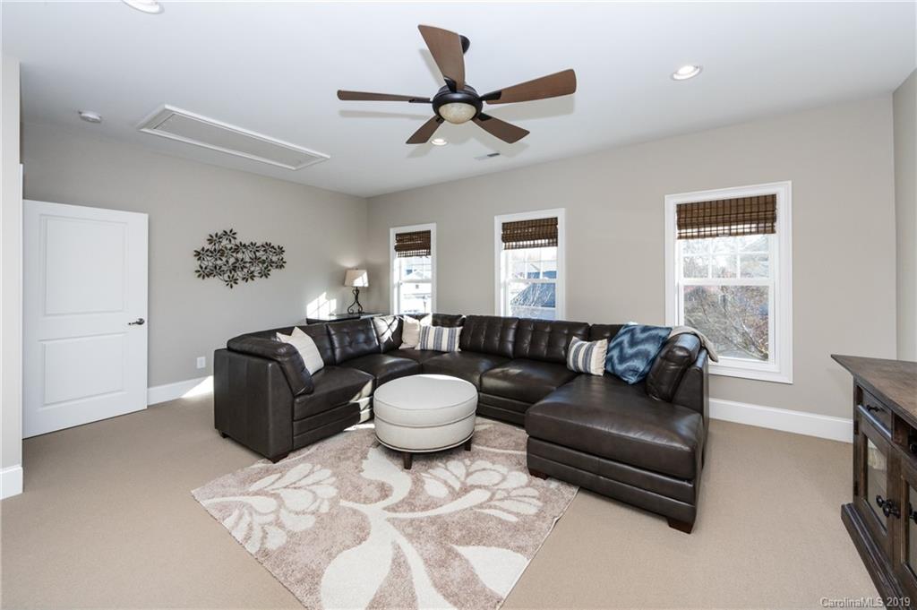 16905 Red Cow Road Charlotte, NC 28277 - Photo 38 of 47 a living room with furniture a window and a fireplace