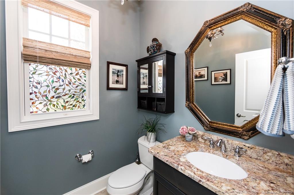 16905 Red Cow Road Charlotte, NC 28277 - Photo 9 of 47 a bathroom with a granite countertop toilet sink and mirror