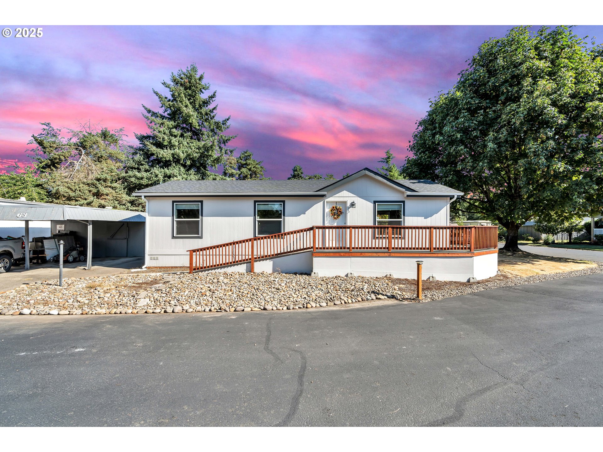 4915 Swegle Road Northeast, Unit 63 Salem, OR 97301 - Photo 1 of 36 a front view of a house with a yard