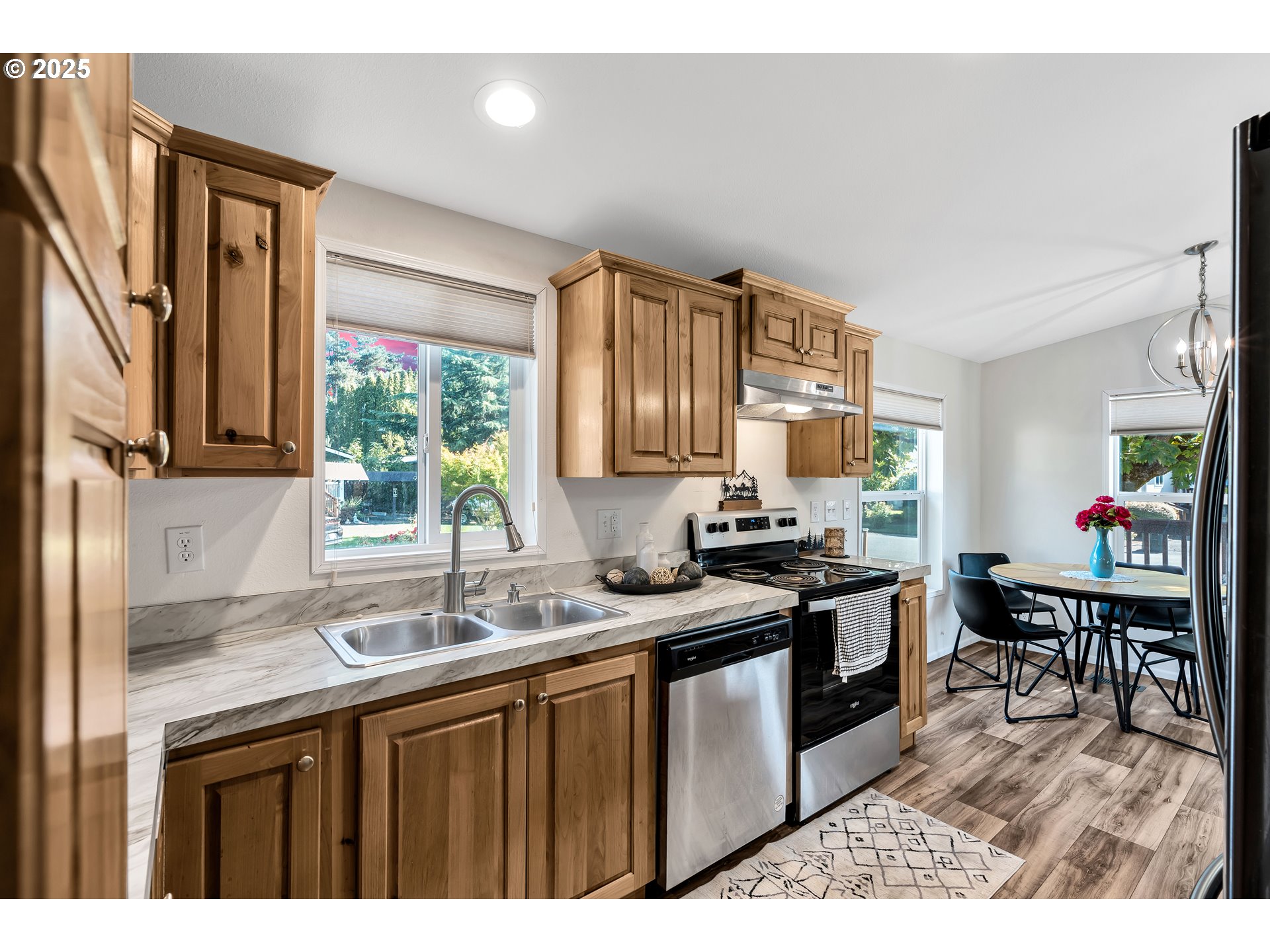 4915 Swegle Road Northeast, Unit 63 Salem, OR 97301 - Photo 13 of 36 a kitchen with stainless steel appliances granite countertop a sink stove and cabinets