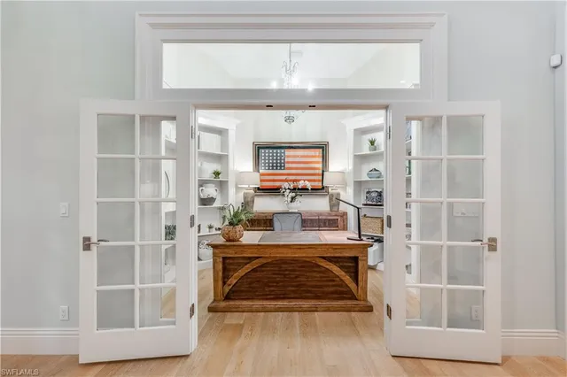 a view of a kitchen with cabinets and wooden floor