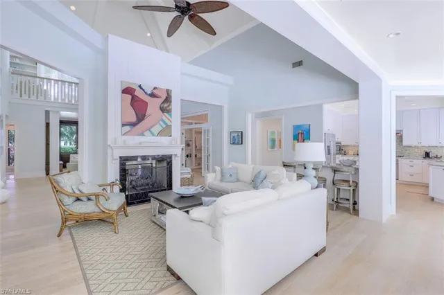 a living room with furniture and fireplace