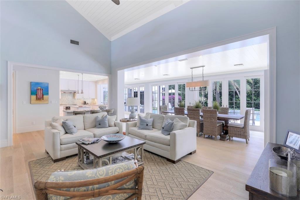 154 4th Avenue North Naples, FL 34102 - Photo 17 of 50 a living room with fireplace furniture and a large window