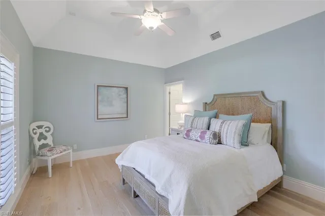 a bedroom with a bed and a chair