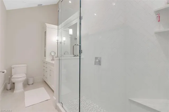 a bathroom with a glass shower door