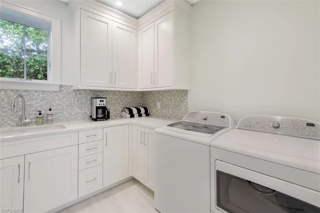 a view of storage and utility room with washer and dryer