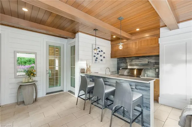 a kitchen with stainless steel appliances granite countertop a sink and cabinets
