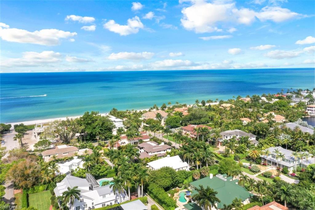 154 4th Avenue North Naples, FL 34102 - Photo 48 of 50 a view of a lake with a city