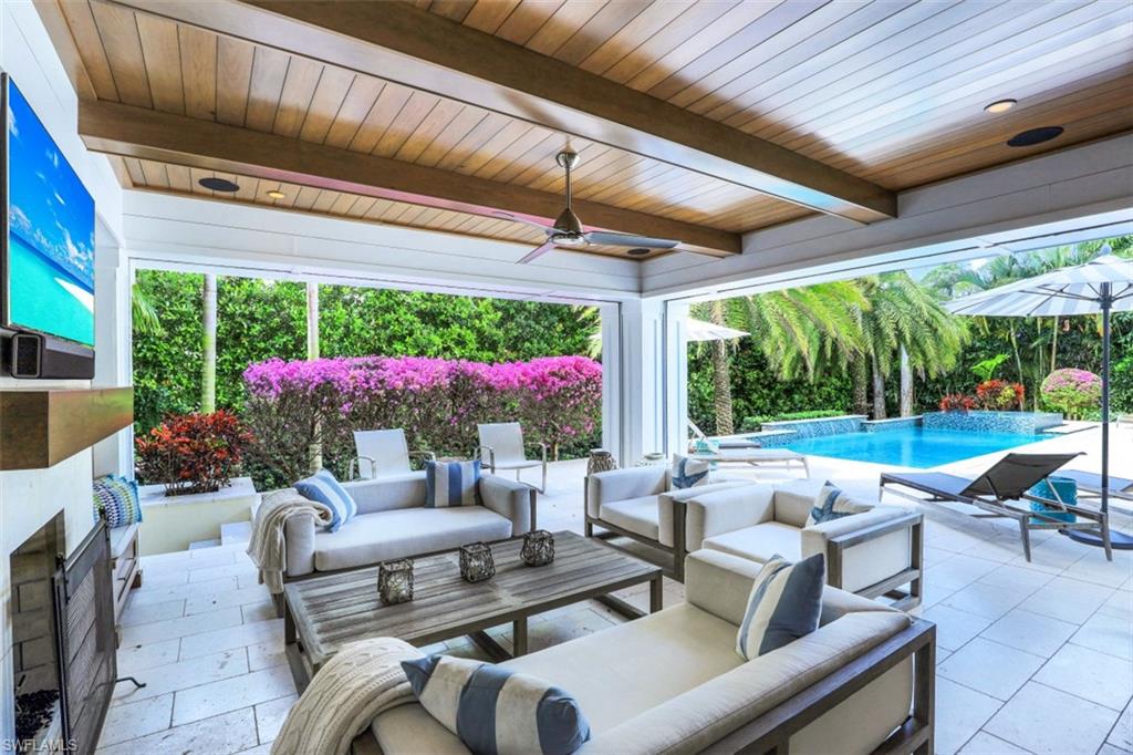 154 4th Avenue North Naples, FL 34102 - Photo 8 of 50 a building outdoor space with patio furniture and potted plants