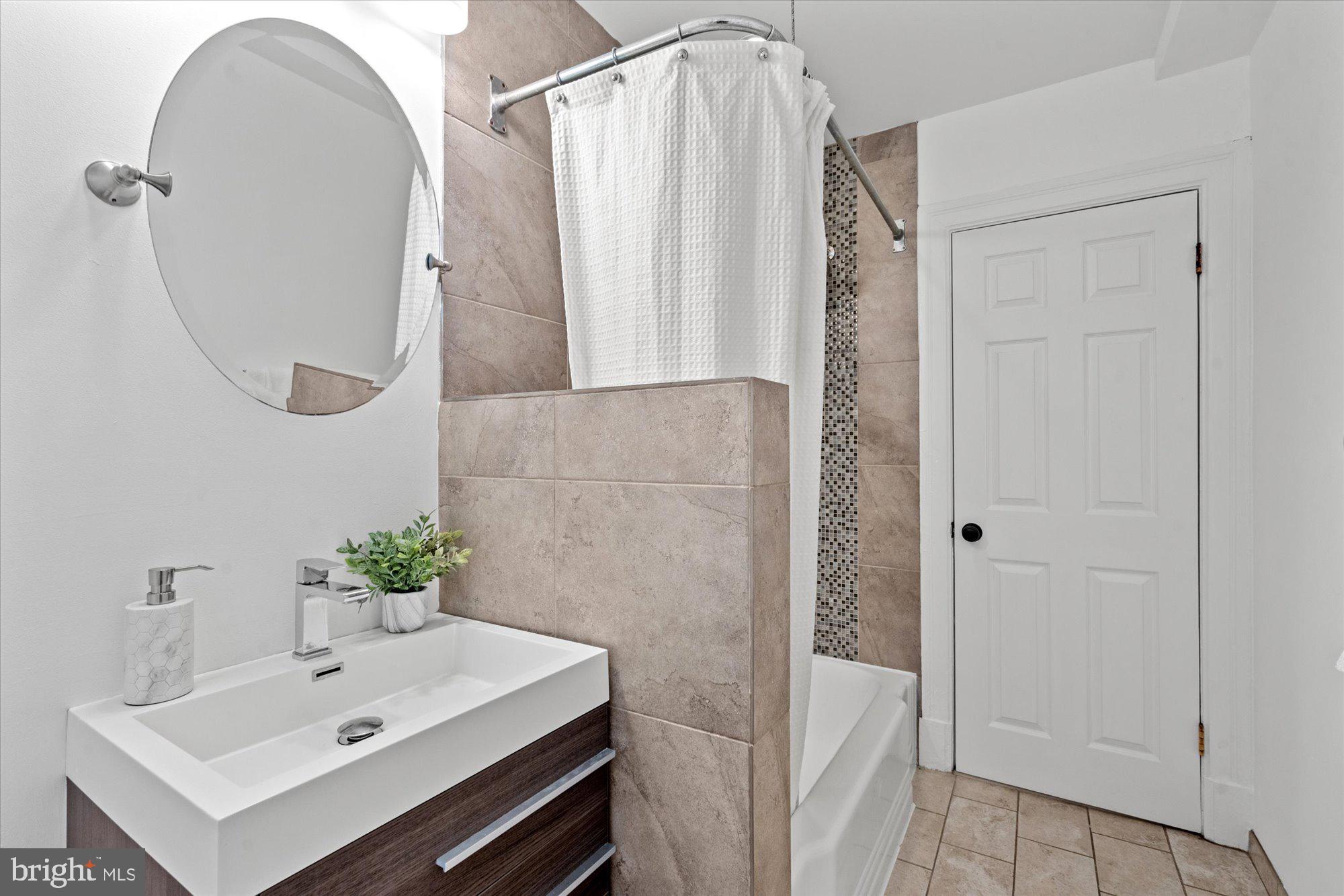 1910 Kalorama Road Northwest, Unit 203 Washington, DC 20009 - Photo 20 of 28 Updated bathroom